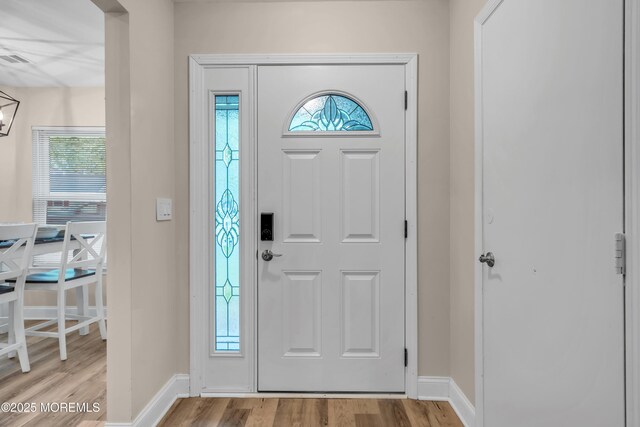 578 Petunia Ln N, Whiting, NJ 08759 - foyer entrance with light wood-style floors and baseboards