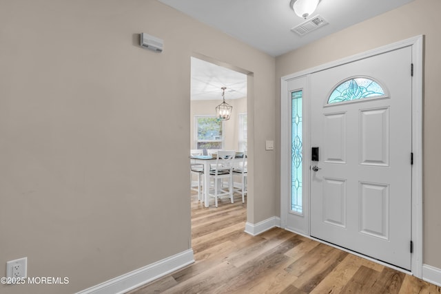 578 Petunia Ln N, Whiting, NJ 08759 - entrance foyer with baseboards, wood finished floors, and a chandelier