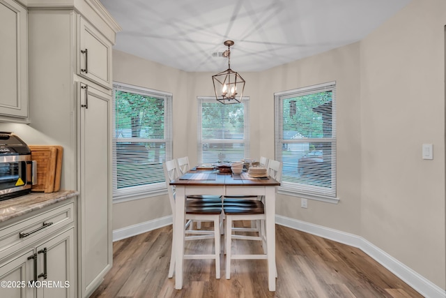 578 Petunia Ln N, Whiting, NJ 08759 - dining area featuring light wood-type flooring, a chandelier, and baseboards