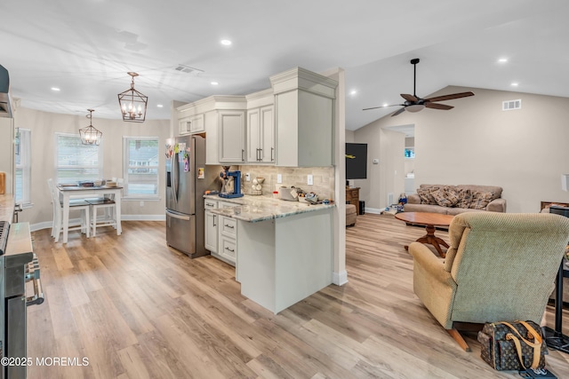 578 Petunia Ln N, Whiting, NJ 08759 - kitchen featuring appliances with stainless steel finishes, ceiling fan, light stone counters, tasteful backsplash, and recessed lighting