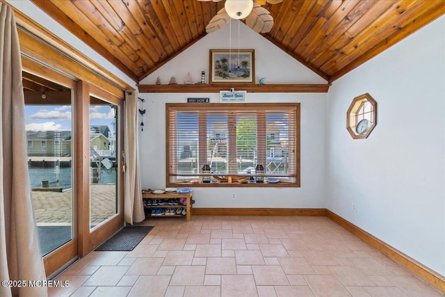 unfurnished sunroom featuring vaulted ceiling and a water view