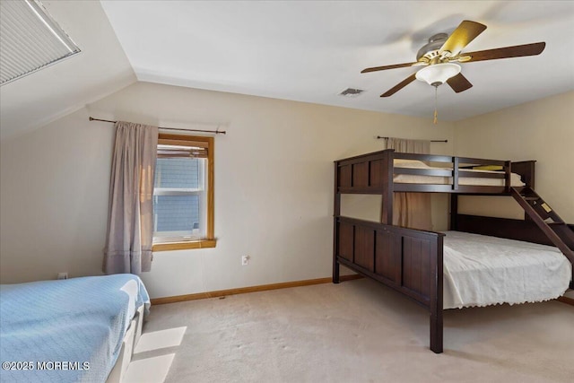 bedroom with carpet floors, lofted ceiling, a ceiling fan, and baseboards