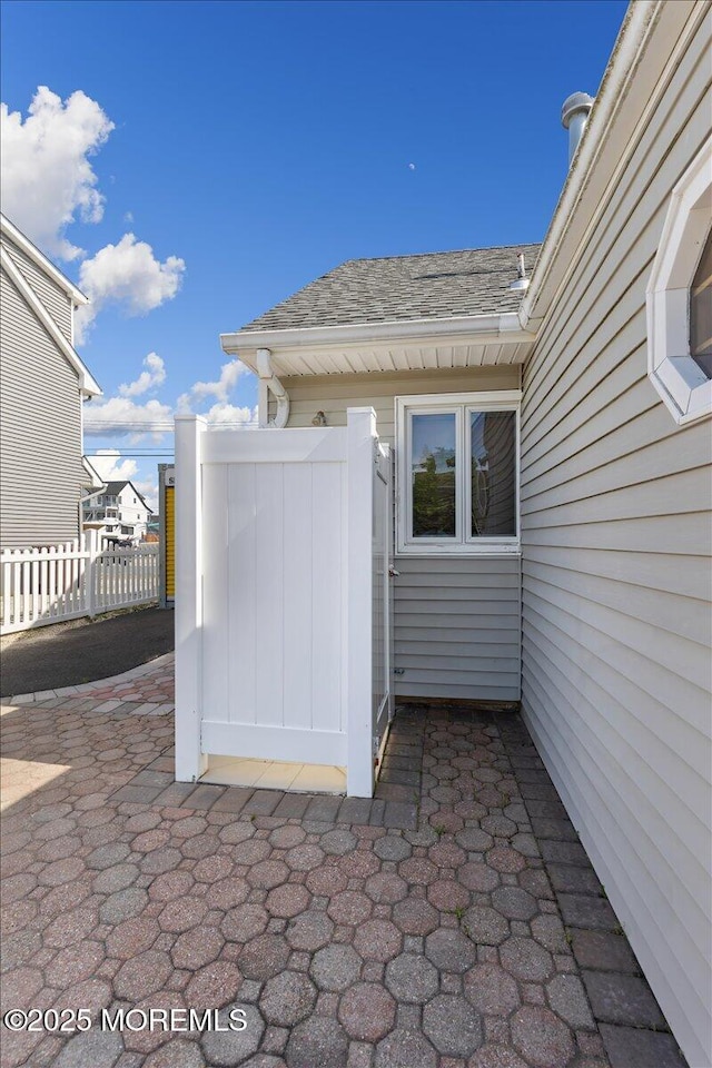 view of patio featuring fence
