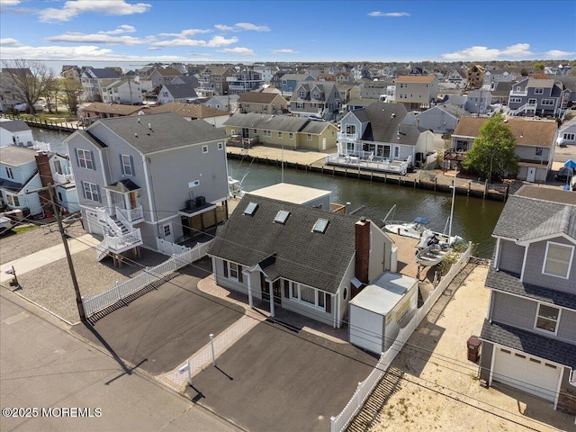 aerial view of residential area with a large body of water