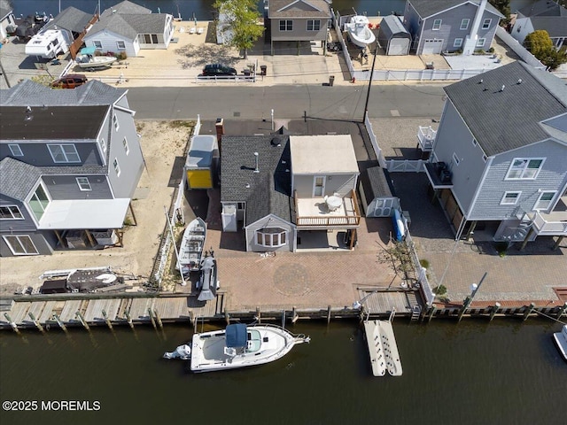 aerial perspective of suburban area featuring a large body of water