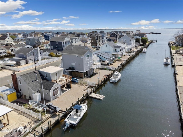 aerial view of residential area with a large body of water