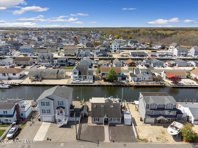 aerial view of residential area with a large body of water