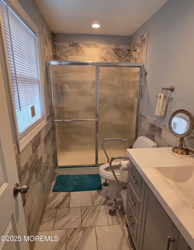 12 Togo Rd, Toms River, NJ 08757 - full bath with toilet, a stall shower, vanity, tile walls, and recessed lighting