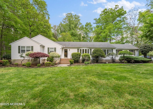 single story home featuring a front yard