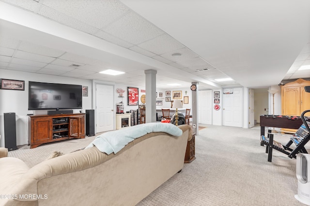 living area with light colored carpet and a paneled ceiling