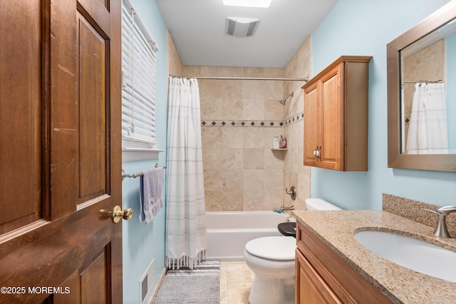 full bath featuring toilet, shower / bath combo, vanity, and tile patterned flooring