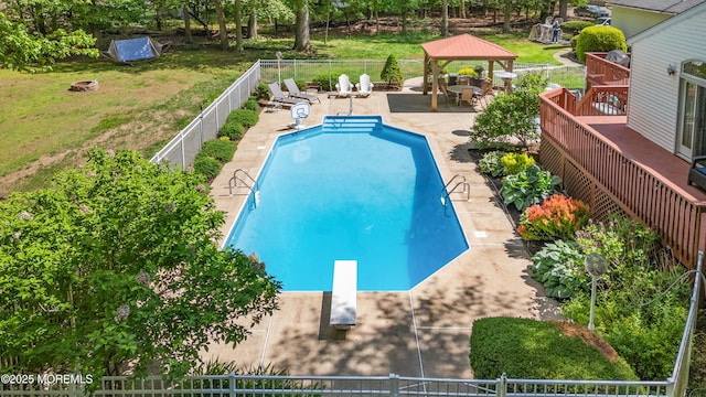 view of swimming pool with a gazebo, a diving board, and a patio