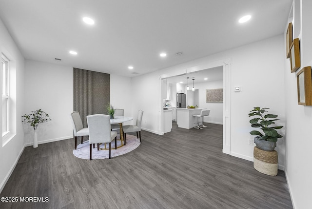dining area featuring recessed lighting, dark wood-type flooring, and baseboards