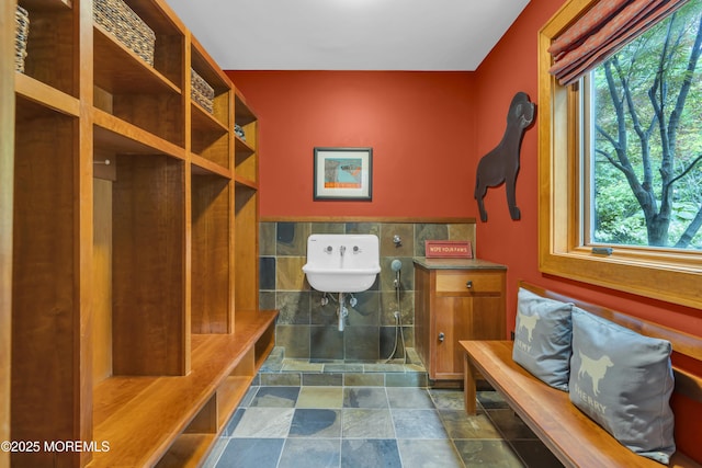 154 Ocean Blvd, Atlantic Highlands, NJ 07716 - mudroom featuring healthy amount of natural light, dark stone finish floors, and a sink
