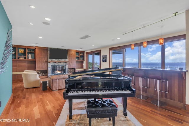 154 Ocean Blvd, Atlantic Highlands, NJ 07716 - sitting room featuring wood finished floors, a fireplace, and recessed lighting
