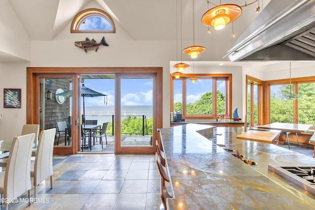154 Ocean Blvd, Atlantic Highlands, NJ 07716 - dining room featuring stone tile flooring, a water view, and high vaulted ceiling