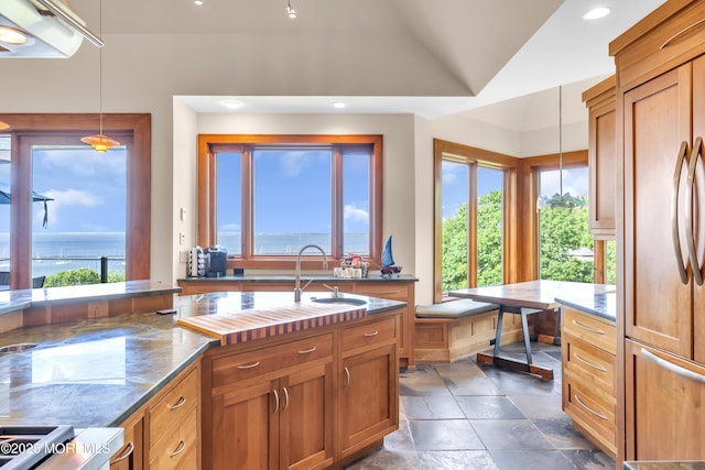 154 Ocean Blvd, Atlantic Highlands, NJ 07716 - kitchen featuring paneled refrigerator, a sink, lofted ceiling, brown cabinets, and recessed lighting