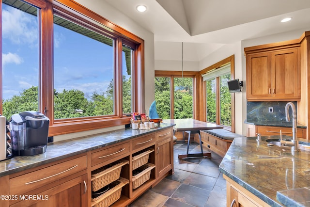 154 Ocean Blvd, Atlantic Highlands, NJ 07716 - kitchen featuring a sink, recessed lighting, dark stone countertops, brown cabinetry, and tasteful backsplash