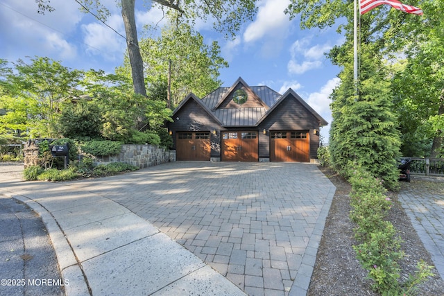 154 Ocean Blvd, Atlantic Highlands, NJ 07716 - view of front of home with a standing seam roof, metal roof, decorative driveway, and a garage