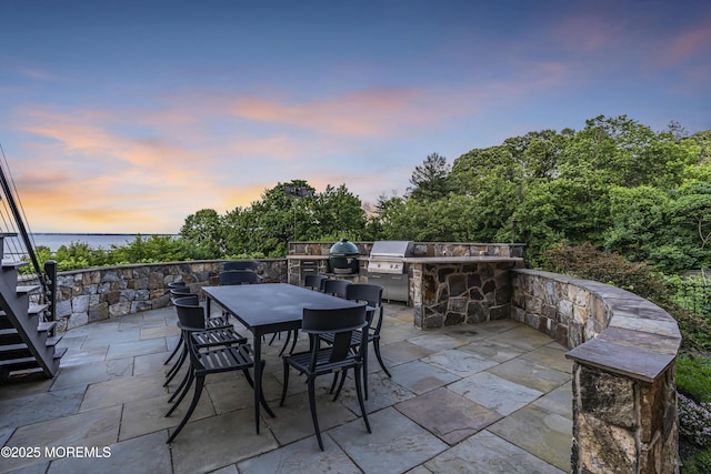 154 Ocean Blvd, Atlantic Highlands, NJ 07716 - patio terrace at dusk with a patio area, outdoor dining area, and stairway