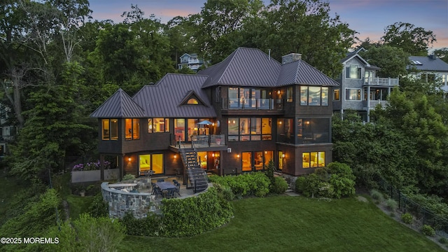 154 Ocean Blvd, Atlantic Highlands, NJ 07716 - rear view of house featuring stairs, a standing seam roof, a yard, and a patio area