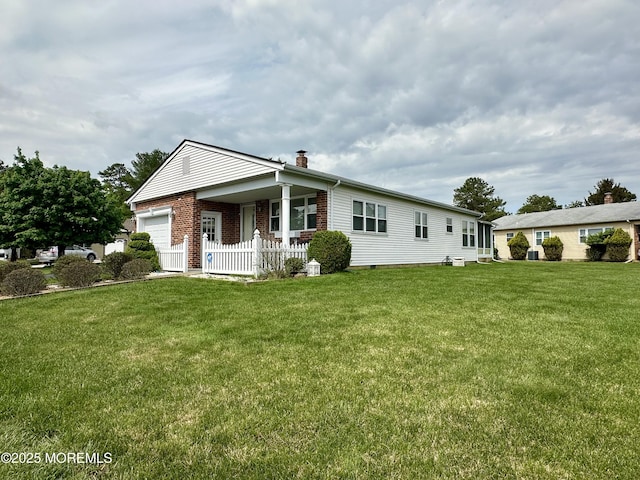 1 Lagos Ct, Toms River, NJ 08757 - view of front of property featuring brick siding, a chimney, and an attached garage