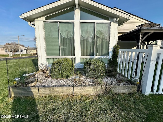 1 Lagos Ct, Toms River, NJ 08757 - view of home's exterior featuring a yard and a sunroom