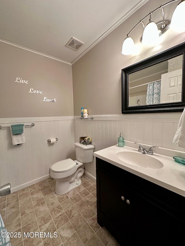 1 Lagos Ct, Toms River, NJ 08757 - bathroom featuring ornamental molding, vanity, wainscoting, and tile patterned flooring