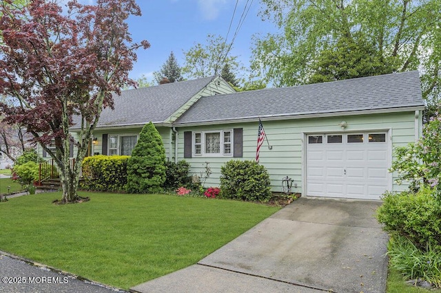 1601 Chestnut Ave, Ocean Twp, NJ 07712 - view of front facade with concrete driveway, a front yard, a garage, and roof with shingles