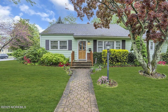 1601 Chestnut Ave, Ocean Twp, NJ 07712 - view of front of house with a front lawn and roof with shingles