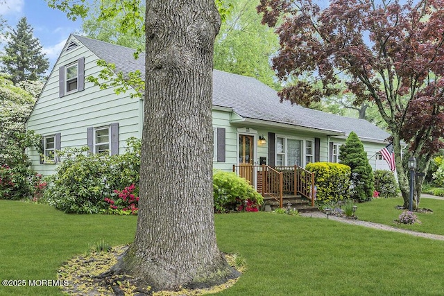 1601 Chestnut Ave, Ocean Twp, NJ 07712 - cape cod home featuring a front lawn, roof with shingles, and a garage
