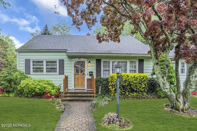 1601 Chestnut Ave, Ocean Twp, NJ 07712 - bungalow-style house with a front yard and roof with shingles