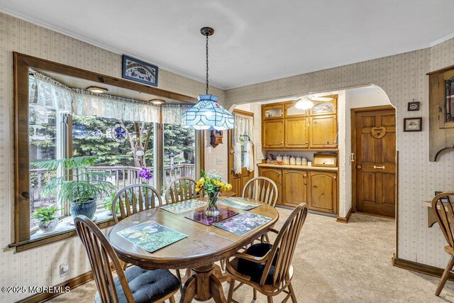 1601 Chestnut Ave, Ocean Twp, NJ 07712 - dining area featuring wallpapered walls, crown molding, light carpet, and baseboards