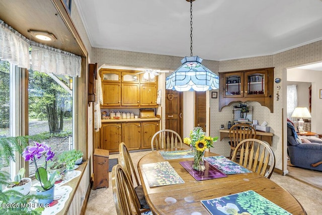 1601 Chestnut Ave, Ocean Twp, NJ 07712 - dining room with wallpapered walls, ornamental molding, a ceiling fan, and light colored carpet