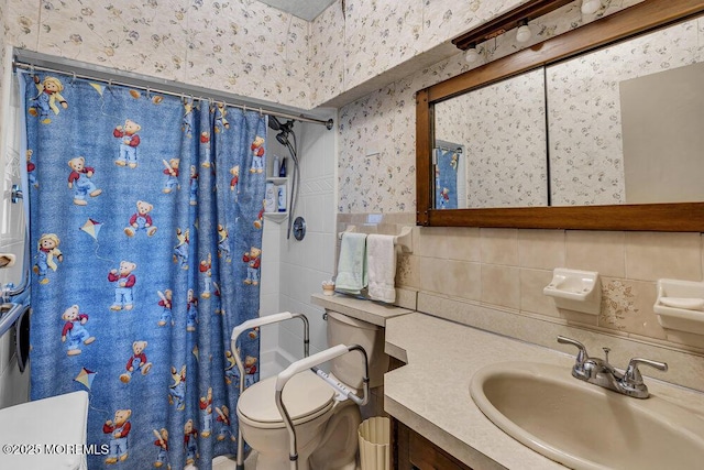 1601 Chestnut Ave, Ocean Twp, NJ 07712 - full bath with wallpapered walls, tile walls, toilet, a shower with curtain, and vanity