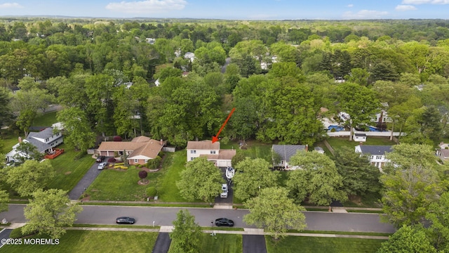 12 Dickinson Ln, Manalapan, NJ 07726 - aerial view of property's location featuring a heavily wooded area and nearby suburban area