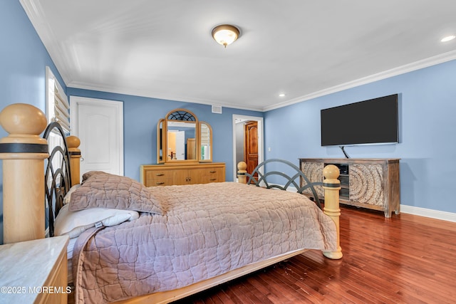 bedroom featuring ornamental molding, hardwood / wood-style floors, baseboards, and recessed lighting