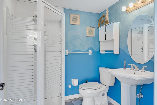 full bath featuring tile patterned flooring, a stall shower, toilet, and baseboards