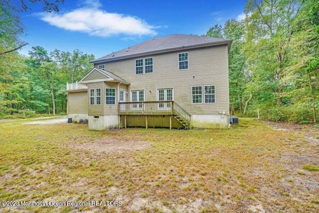2557 Huckleberry Rd, Manchester, NJ 08759 - rear view of property featuring a deck, a lawn, stairway, and cooling unit