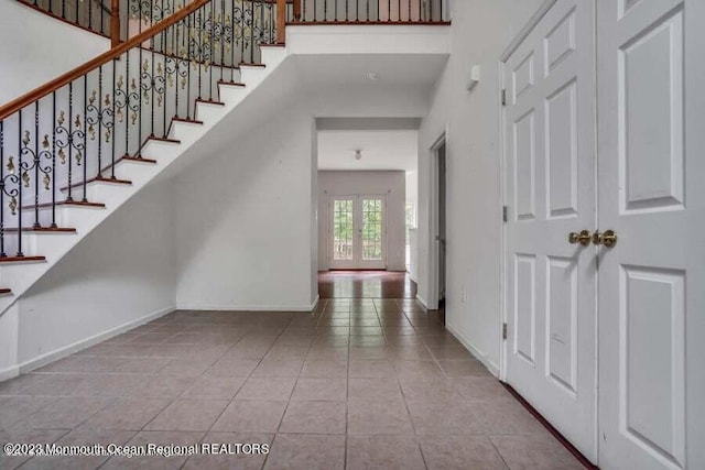 2557 Huckleberry Rd, Manchester, NJ 08759 - tiled entryway with baseboards and stairway