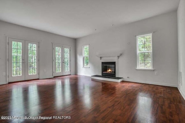 2557 Huckleberry Rd, Manchester, NJ 08759 - unfurnished living room with plenty of natural light, wood finished floors, and baseboards