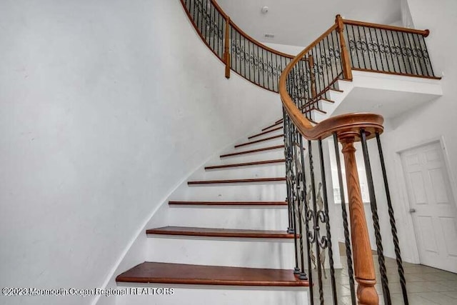 2557 Huckleberry Rd, Manchester, NJ 08759 - staircase featuring a towering ceiling and tile patterned flooring