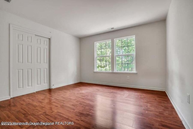 2557 Huckleberry Rd, Manchester, NJ 08759 - unfurnished bedroom featuring wood finished floors, a closet, and baseboards