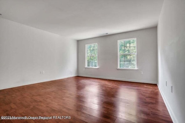 2557 Huckleberry Rd, Manchester, NJ 08759 - empty room with dark wood-style floors and baseboards