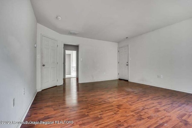 2557 Huckleberry Rd, Manchester, NJ 08759 - empty room with wood finished floors, baseboards, and a smoke detector