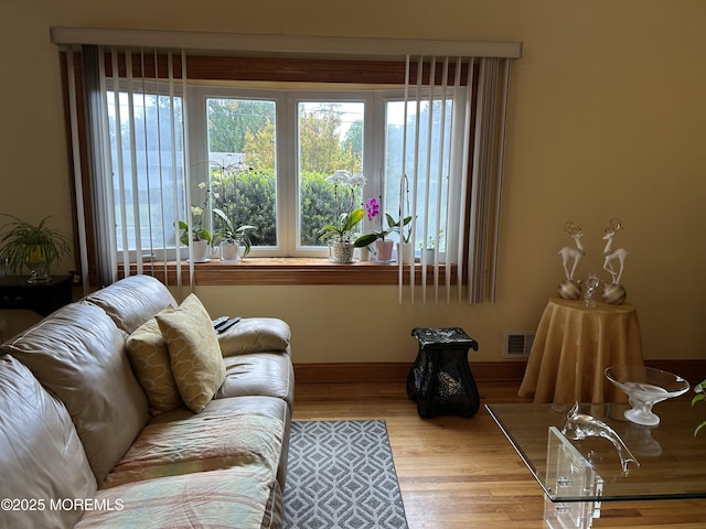 living room with wood finished floors and baseboards