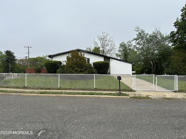 view of side of home with fence