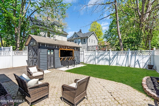 view of patio with an outbuilding