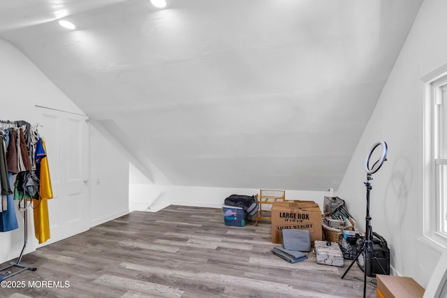 bonus room with lofted ceiling, wood finished floors, and recessed lighting