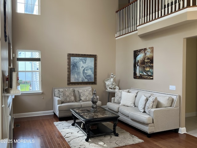 27 Stonehenge Ct, Jackson, NJ 08527 - living area featuring a towering ceiling, baseboards, wood finished floors, and plenty of natural light